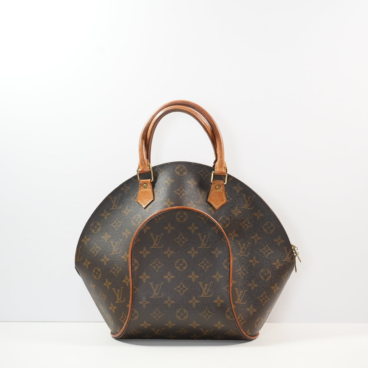 Louis Vuitton Ellipse handbag in monogram brown in distinctive rigid curved sihouette (dustbag)