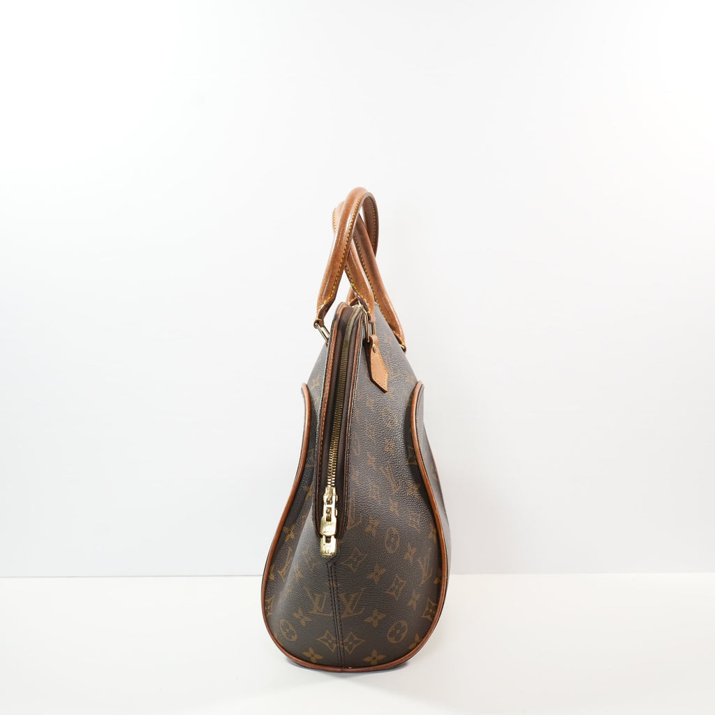 Louis Vuitton Ellipse handbag in monogram brown in distinctive rigid curved sihouette (dustbag)