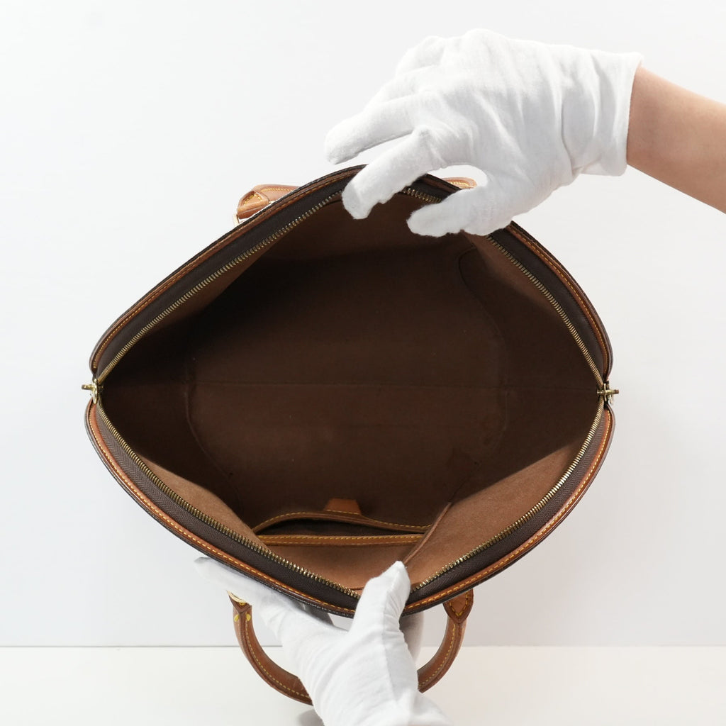 Louis Vuitton Ellipse handbag in monogram brown in distinctive rigid curved sihouette (dustbag)
