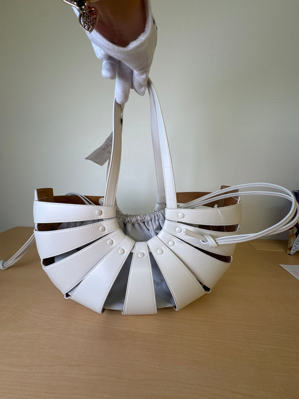 Japan Exclusive: Bottega Veneta White Leather Cage Bucket Shoulder Bag with Grey Drawstring Pouch