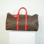 Louis Vuitton Keepall Bandouliere Monogram Canvas Duffle Bag Red Trim
