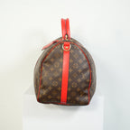 Louis Vuitton Keepall Bandouliere Monogram Canvas Duffle Bag Red Trim