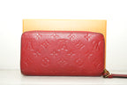 Louis Vuitton Sarah Wallet in black Monogram Empreinte leather
