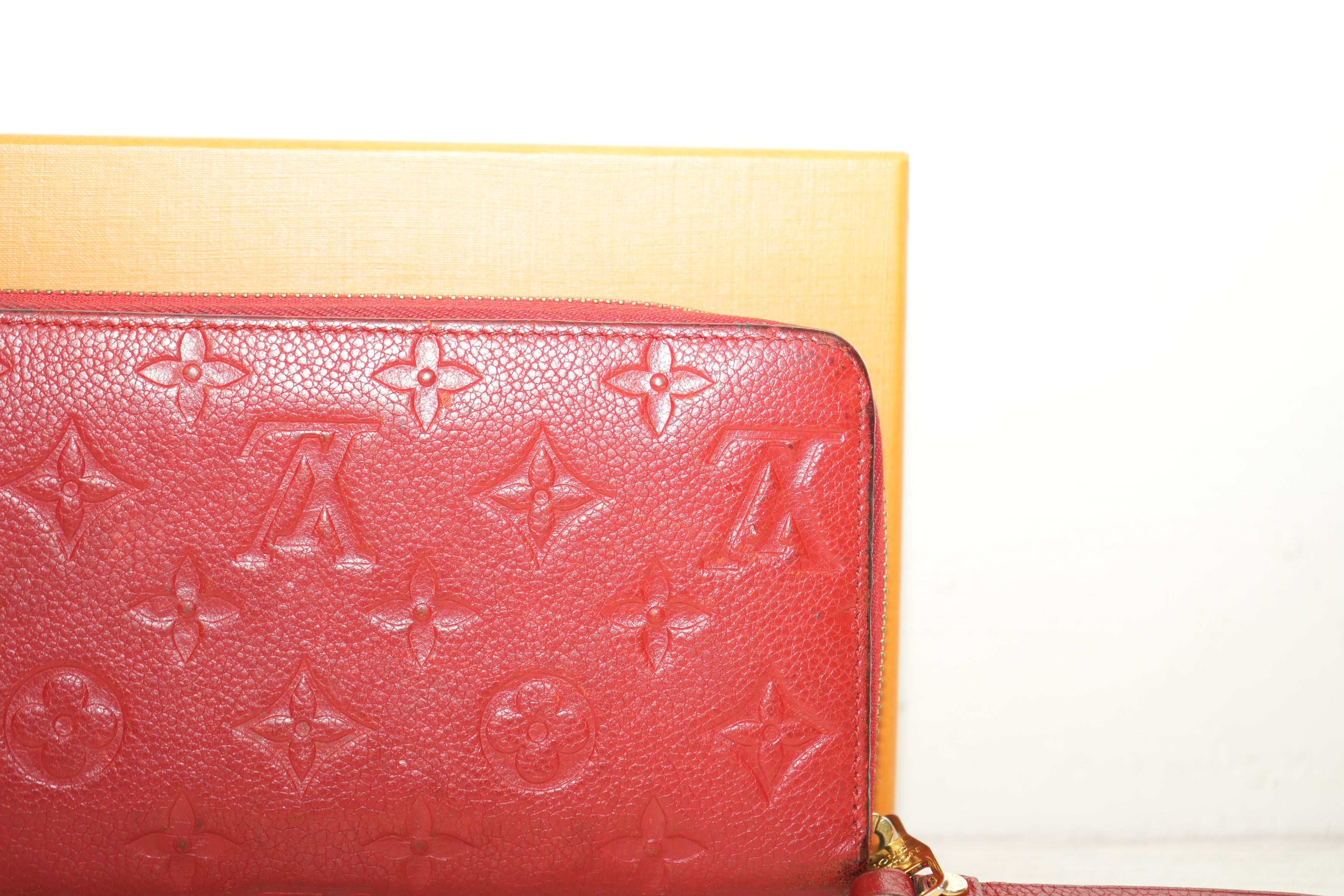 Louis Vuitton Sarah Wallet in black Monogram Empreinte leather