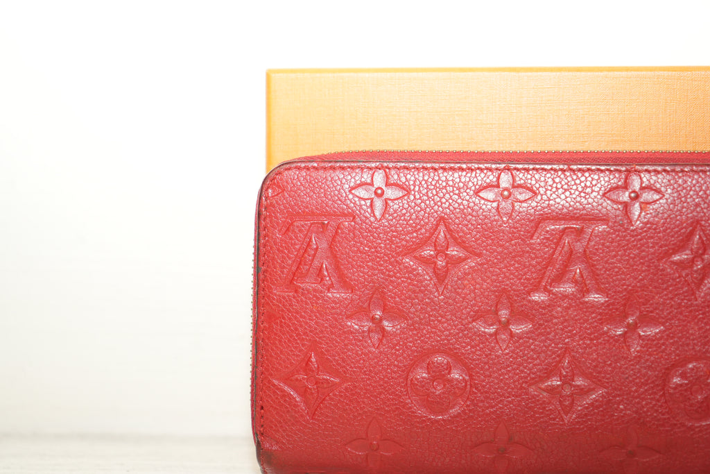 Louis Vuitton Sarah Wallet in black Monogram Empreinte leather